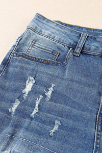 Jeans effetto consumato a vita media patchwork a quadri