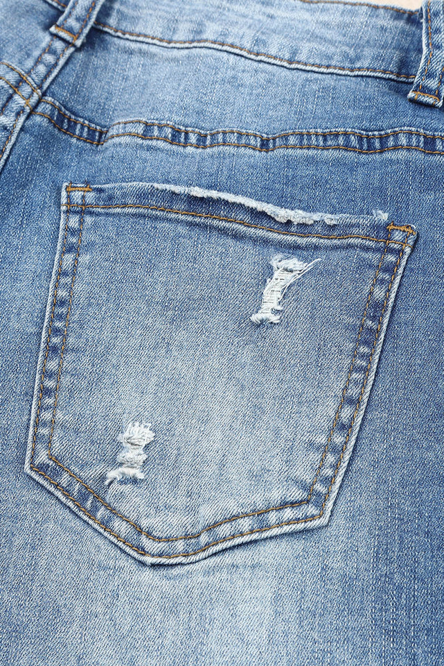 Jeans effetto consumato a vita media patchwork a quadri