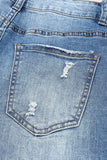 Jeans effetto consumato a vita media patchwork a quadri