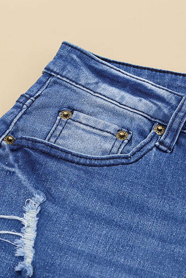 Jeans a gamba svasata effetto vissuto con tasche