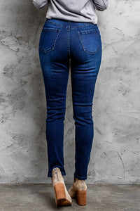 Jeans skinny effetto consumato a vita media