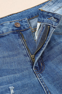 Jeans effetto consumato a vita media patchwork a quadri