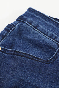 Jeans skinny effetto consumato a vita media