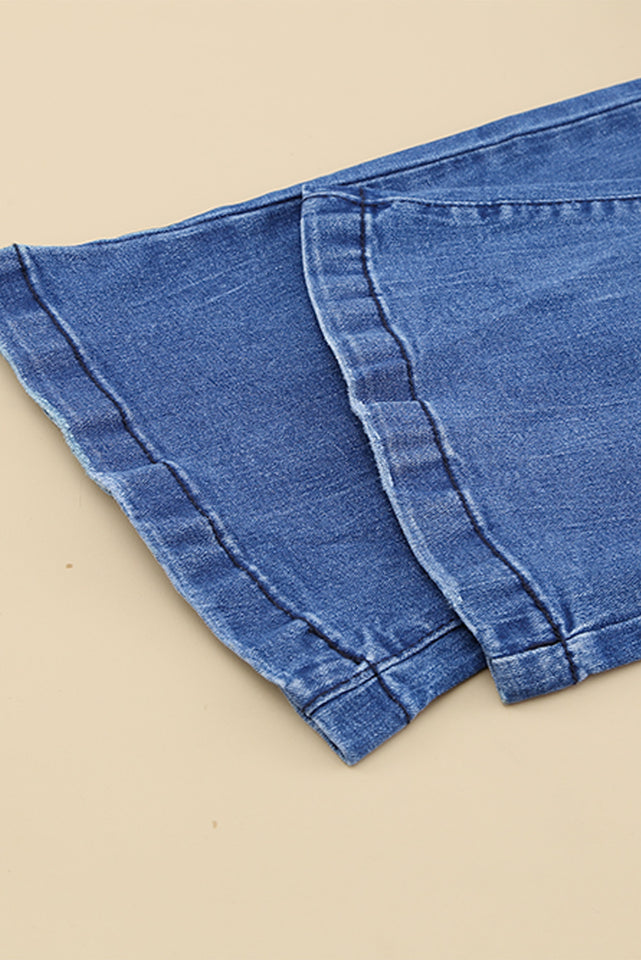 Jeans a gamba svasata effetto vissuto con tasche