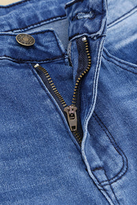 Jeans a gamba svasata effetto vissuto con tasche