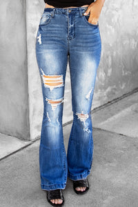 Jeans a gamba svasata effetto vissuto con tasche
