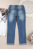 Jeans effetto consumato a vita media patchwork a quadri