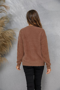 Maglione sfocato con collo tondo e spalle scese